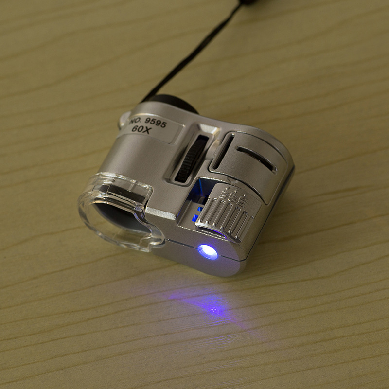Kính Hiển Vi Cầm Tay Bỏ Túi Có Đèn Led Phóng Đại 60X