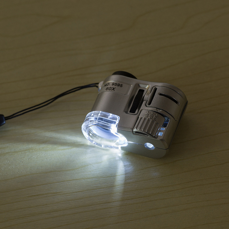 Kính Hiển Vi Cầm Tay Bỏ Túi Có Đèn Led Phóng Đại 60X