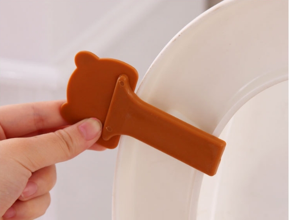 Que Kẹp Nắp Vệ Sinh