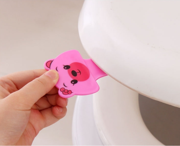 Que Kẹp Nắp Vệ Sinh